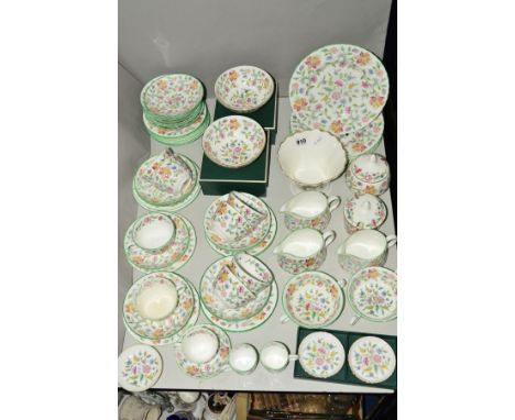 A MINTON 'HADDON HALL' TEA SERVICE, including five plates measuring 23cm diameter, fourteen side plates, fifteen saucers, eig