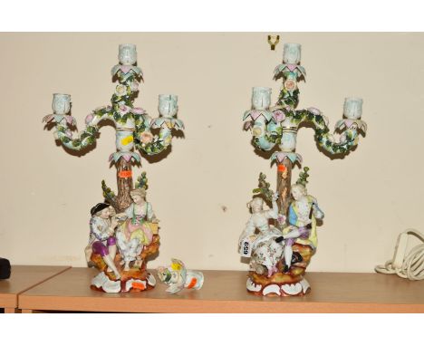 A PAIR OF DRESDEN AUGUSTUX REX STYLE FIGURAL CANDELABRA, each candlestick with three branches and central candleholder, young