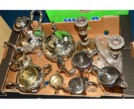 A BOX OF SILVER PLATE, comprising a pair of worn Old Sheffield plate telescopic candlesticks, a Victorian four piece tea/coff