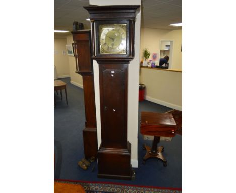 A GEORGE III OAK LONGCASE CLOCK, the hood flanked by cylindrical pillars, the brass and silvered dial with Roman numerals, si