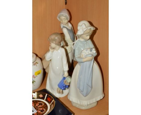 THREE NAO FIGURES, Girl holding pup in blanket No241, height 25.5cm, 'My Rag Doll' No 1108 and Graceful No 237 (3)