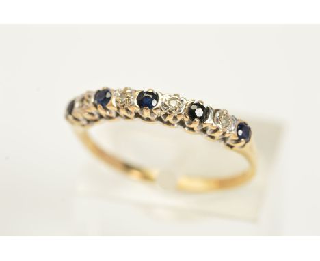 A 9CT GOLD DIAMOND AND SAPPHIRE RING, designed as a row of four single cut diamonds within illusion settings interspaced with