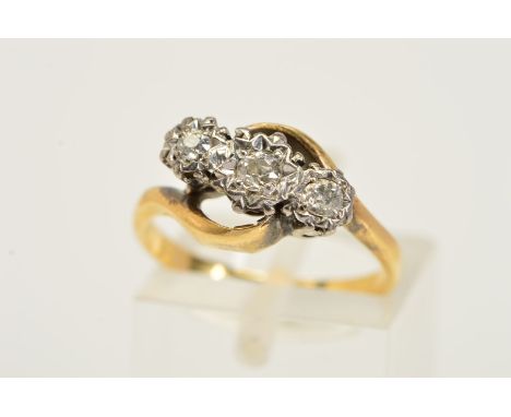 AN 18CT GOLD THREE STONE DIAMOND RING, designed as three graduated round brilliant cut diamonds within illusion settings and 