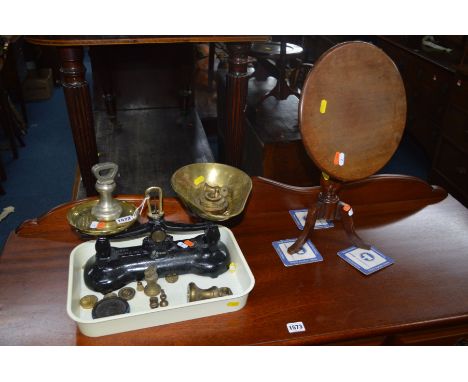 A LIBRA &amp; CO CAST IRON AND BRASS BALANCE SCALE with weights together with a miniature mahogany circular tilt top tripod t