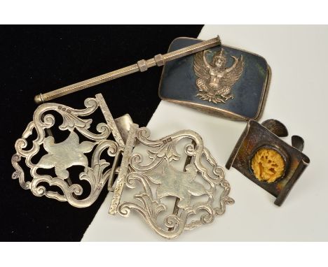 FOUR MISCELLANEOUS ITEMS, to include a silver nurses buckle, with hallmark for London 1968, an engine turned retractable swiz