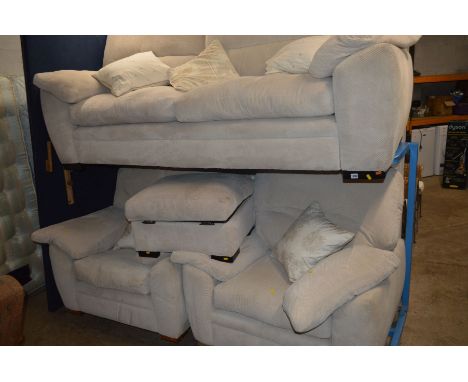 A CREAM UPHOLSTERED FOUR PIECE SUITE comprising of a two seat settee, two arm chairs and a pouffe (4)