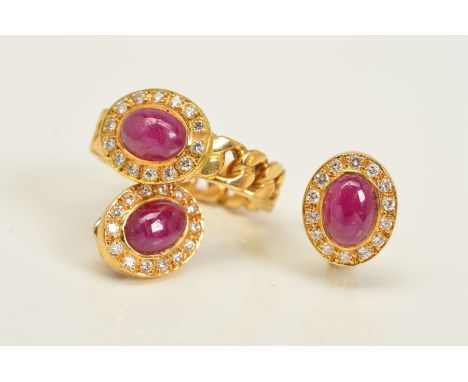 A DIAMOND AND RUBY RING AND EARRINGS SET, the ring designed with a central oval cut ruby cabochon with diamond surround to th