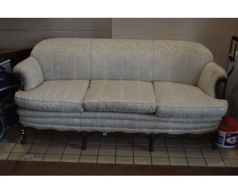 A VICTORIAN MAHOGANY THREE SEATER SETTEE, with scrolled arms and four matching front legs, width 200cm