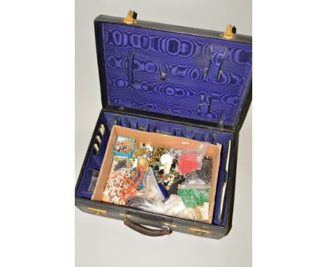 A VINTAGE SUITCASE WITH COSTUME JEWELLERY, to include paste necklaces, broken necklaces etc and a vintage suitcase with inter