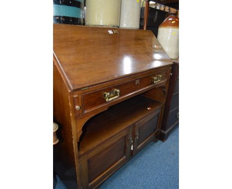 A EDWARDIAN MAHOGANY FALL FRONT BUREAU with one drawer an open shelf and two doors below, width 97cm x depth 53cm x height 10