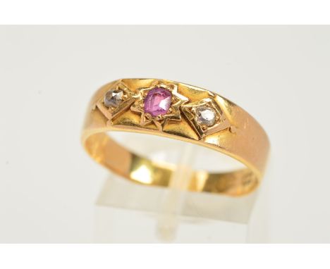 A MID VICTORIAN 18CT GOLD RUBY AND DIAMOND RUBY RING, designed as a central circular ruby within a star setting flanked by si