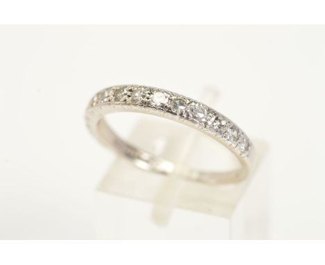 AN 18CT WHITE GOLD RING, designed as a half eternity ring set with twelve slightly graduated single cut diamonds, total estim