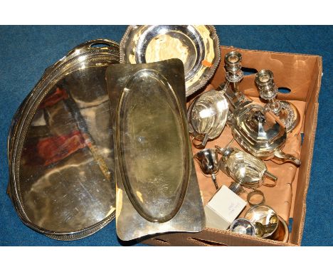 A BOX OF SILVER PLATE, to include a pair of candlesticks, a crumb tray, three piece tea service, galleried tray, cigar ash tr