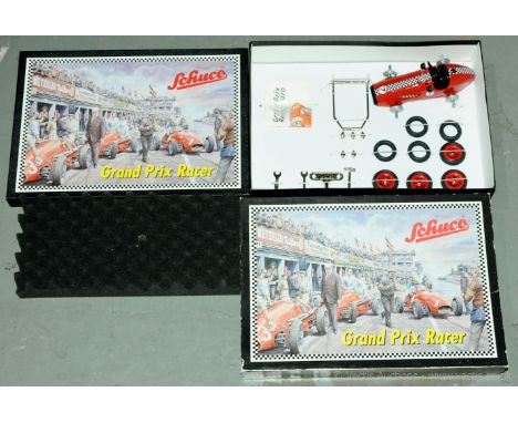 Schuco "Grand Prix Racer" - set contains a kit of parts to build a tinplate clockwork Racing Car - Red with racing number dec