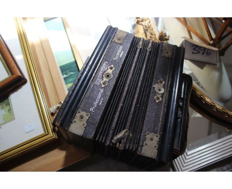 Mixed lot: an Adolphus small accordion (30cm wide), a singer manual sewing machine model 128K, and a Remington standard porta