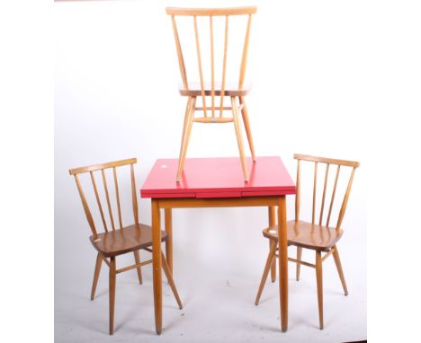 A set of three Ercol spindle back dining chairs and a kitchen table