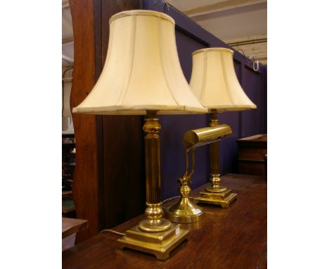 A pair of brass column form table lamps with shades and a brass desk lamp, modern (sold as parts)