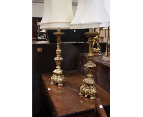 A pair of gilt plaster table lamps with shades. Modern. Lamp bases 54cm high (sold as parts)