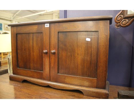 A mahogany table top shallow cabinet fitted adjustable shelves, on bracket feet, w: 80cm, h: 48cm, D: 20cm