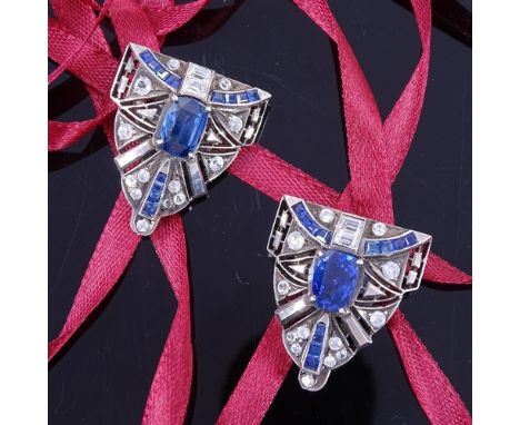 A pair of Art Deco unmarked silver sapphire and paste dress clips, geometric opposing form set with oval and graduated calibr