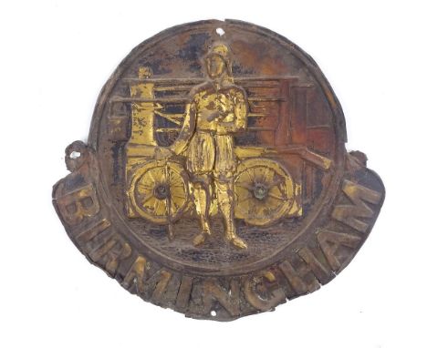A 19th century embossed brass Birmingham fire mark, depicting a fireman and engine, height 26cm 