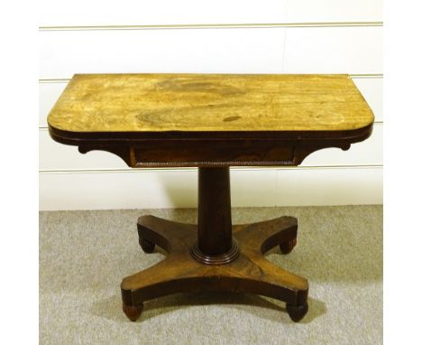 A 19th century rosewood fold over card table, on platform base 