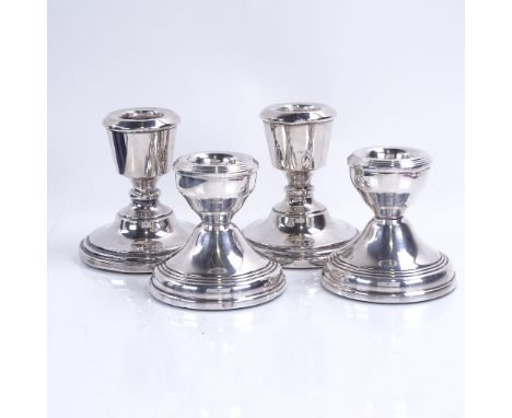 4 silver-mounted squat candlesticks, largest height 7cm, loaded basesGood overall condition, there is a matching pair, the ot