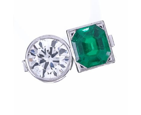 A 2-stone emerald and diamond ring, set with an octagonal emerald within a square surround and a collet-set 2.25ct round bril