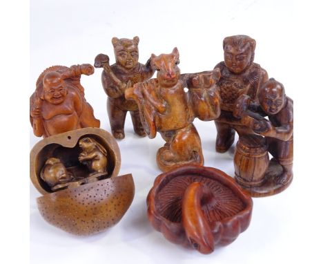 A group of Japanese carved wood netsuke and okimono, including a rat carrying a backpack, height 6cm 