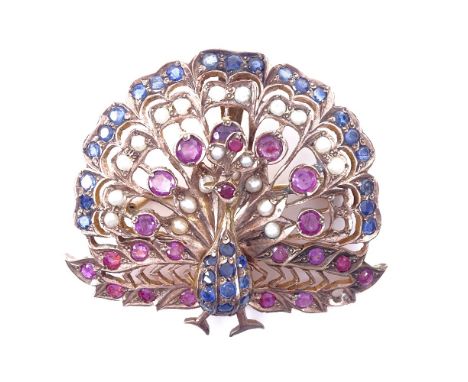 An Indian unmarked yellow metal ruby sapphire and pearl peacock pendant/brooch, pendant height 45.3mm, 22.6gGood overall cond