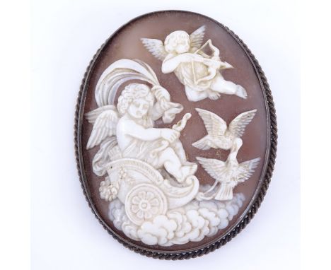 A 19th century relief carved shell cameo panel brooch, depicting cherubs and doves, in unmarked yellow metal frame, brooch he