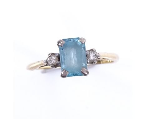 A late 20th century 18ct gold 3-stone blue topaz and diamond dress ring, topaz length 7.3mm, size J, 2.1gFair overall conditi