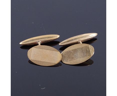 A pair of mid-20th century 9ct gold oval panel cufflinks, engine turned decoration, hallmarks Birmingham 1964, panel length 1