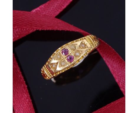 An early 20th century 18ct gold ruby and split pearl dress ring, hallmarks Birmingham 1905, setting height 6.6mm, size P, 2.4