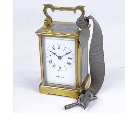 A brass-cased carriage clock timepiece, examined by Mappin & Webb, white enamel dial with Roman numeral hour markers and blue