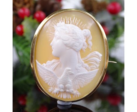 A 19th century relief carved shell cameo panel brooch, depicting Eos, Goddess of the Dawn, in unmarked frame which tests as 1