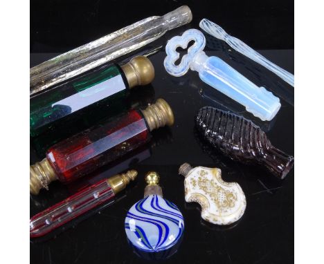 A group of mainly 19th century glass scent bottles, including ruby and green double-ended, and an opalescent glass flask with