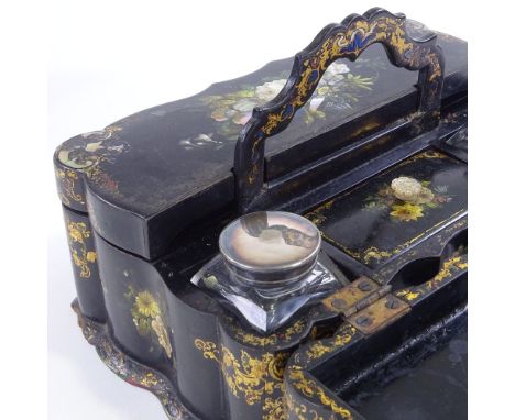 A Victorian papier mache writing box with carrying handle, allover hand painted and mother-of-pearl inlaid floral decoration 