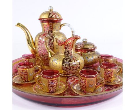 An impressive Moser gilded cranberry glass tea set on circular tray, with enamel butterfly designs, tray diameter 42cmVery go