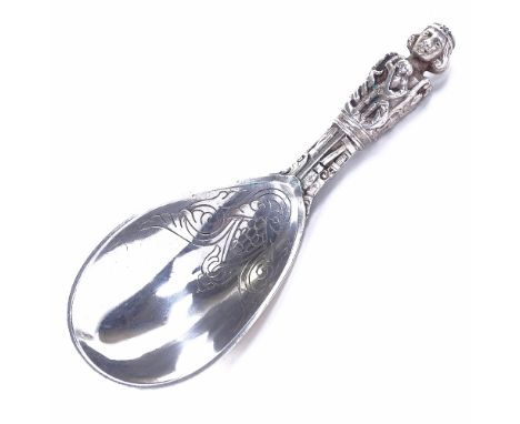 An early 20th century Danish silver presentation ladle, religious figure decorated handle with foliate engraved bowl, by A Dr