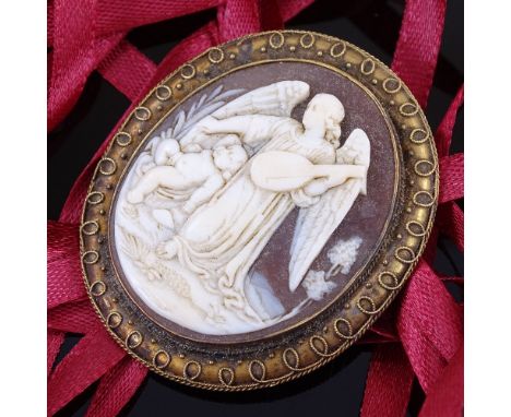 A 19th century relief carved shell cameo panel pendant/brooch, depicting angel playing a lute, in unmarked yellow metal frame