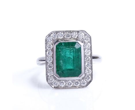 A modern 9ct white gold emerald and diamond cluster panel ring, in Art Deco style, total diamond content approx 0.35ct, emera