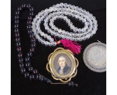 A rock crystal bead necklace, a Victorian gilt-metal brooch with inset painted portrait, a coin set brooch etc 