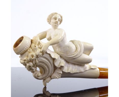 A 19th century Meerschaum pipe surmounted by a nude reclining woman, length 13.5cm, original fitted casePart of the woman's f