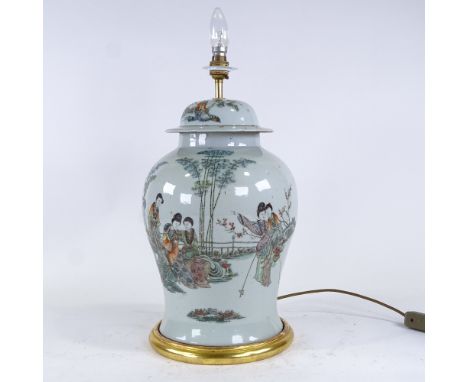 A Chinese white glaze porcelain jar and cover converted to a table lamp, with panels of text inscription, on giltwood base, h