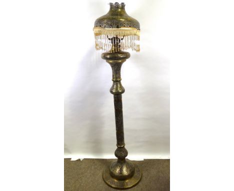 An Islamic brass lamp standard, probably late 19th century, allover inlaid silver and copper decoration on engraved ground, w