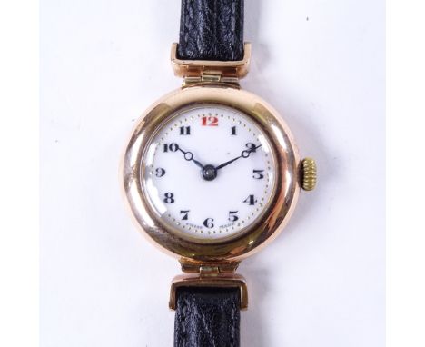 A lady's Vintage 9ct rose gold mechanical dress wristwatch, white enamel dial with Deco painted Arabic numerals and blued ste