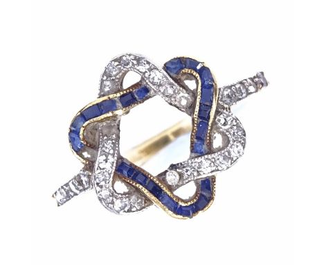 An early 20th century unmarked high carat gold sapphire and diamond dress ring, inverted intertwined double triangle head set