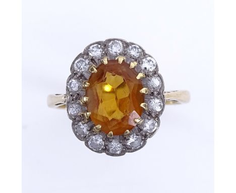 An 18ct gold citrine and diamond cluster ring, total diamond content approx 0.4ct, setting height 14.7mm, size L, 3.6gGood ov