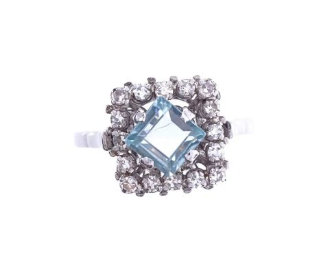 An early 20th century French 18ct white gold aquamarine and diamond cluster dress ring, setting height 12.3mm, size Q, 5.1gGo